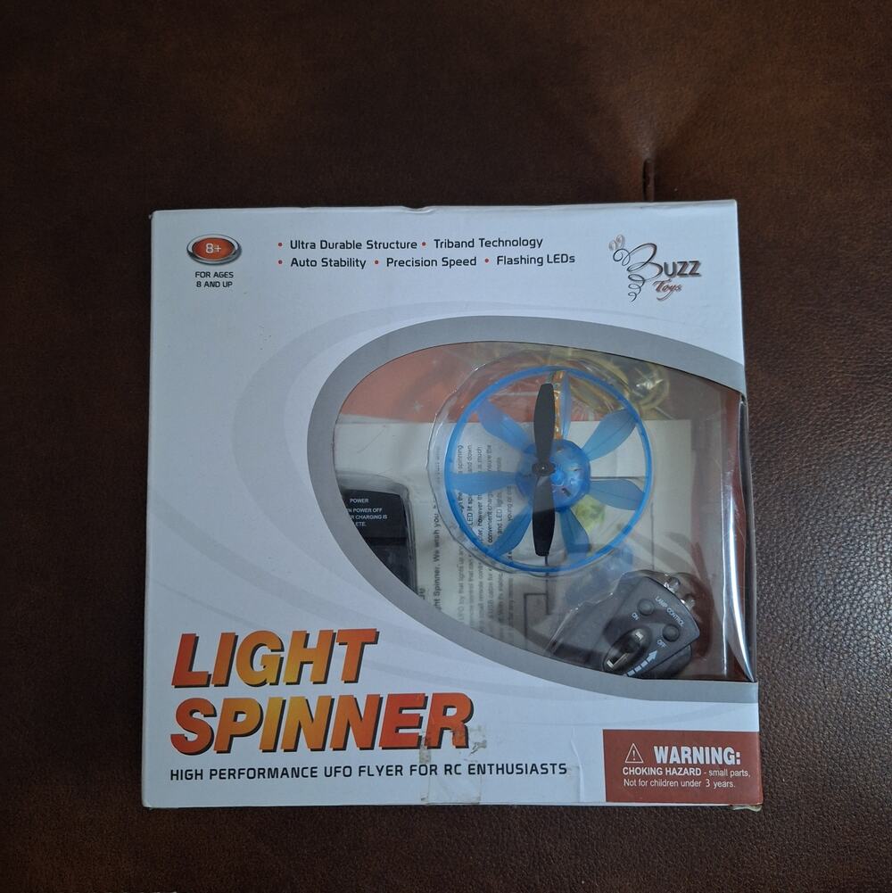 ​Buzz Retail Light Spinner RC UFO Flyer Drone Flying Toy Blue LED Flashing NIB